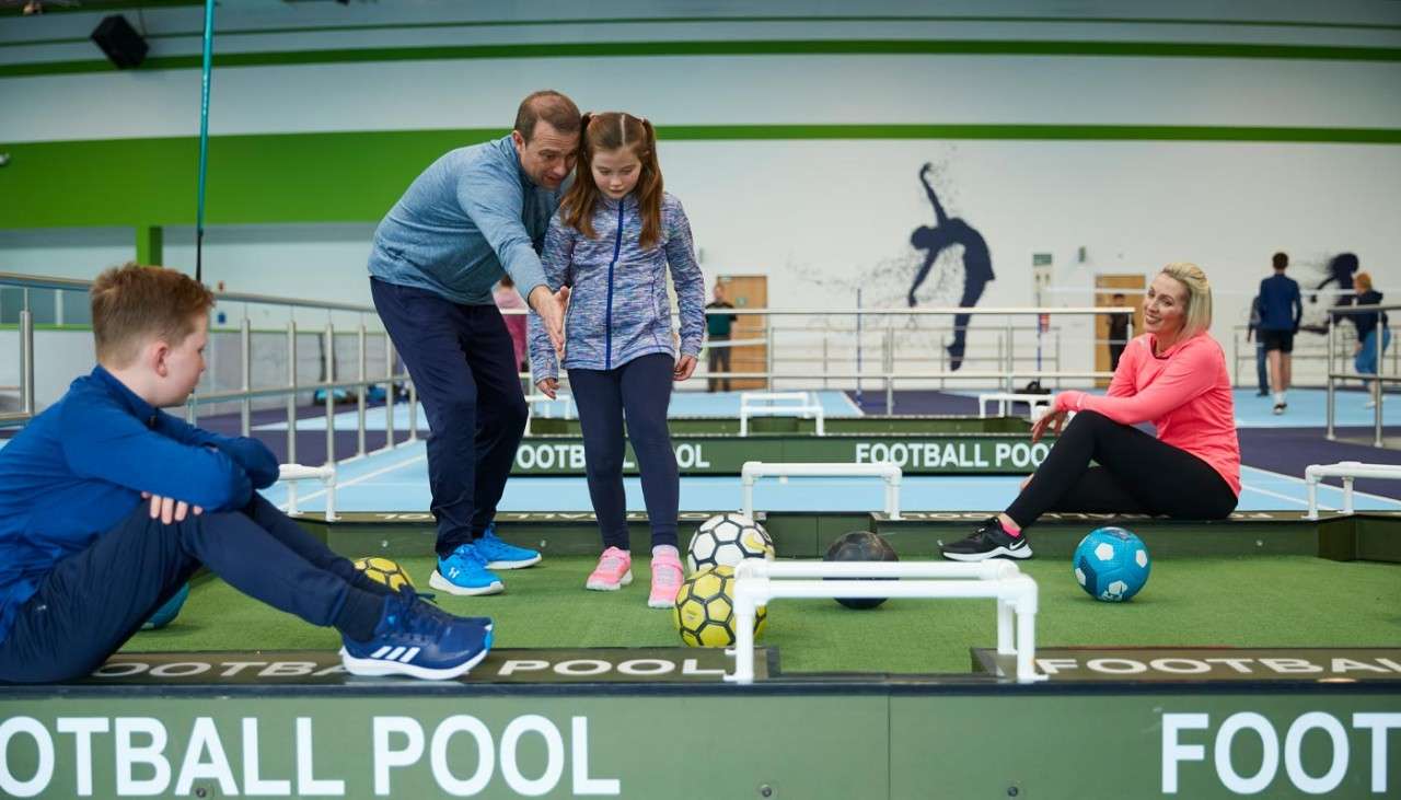 Family playing football pool