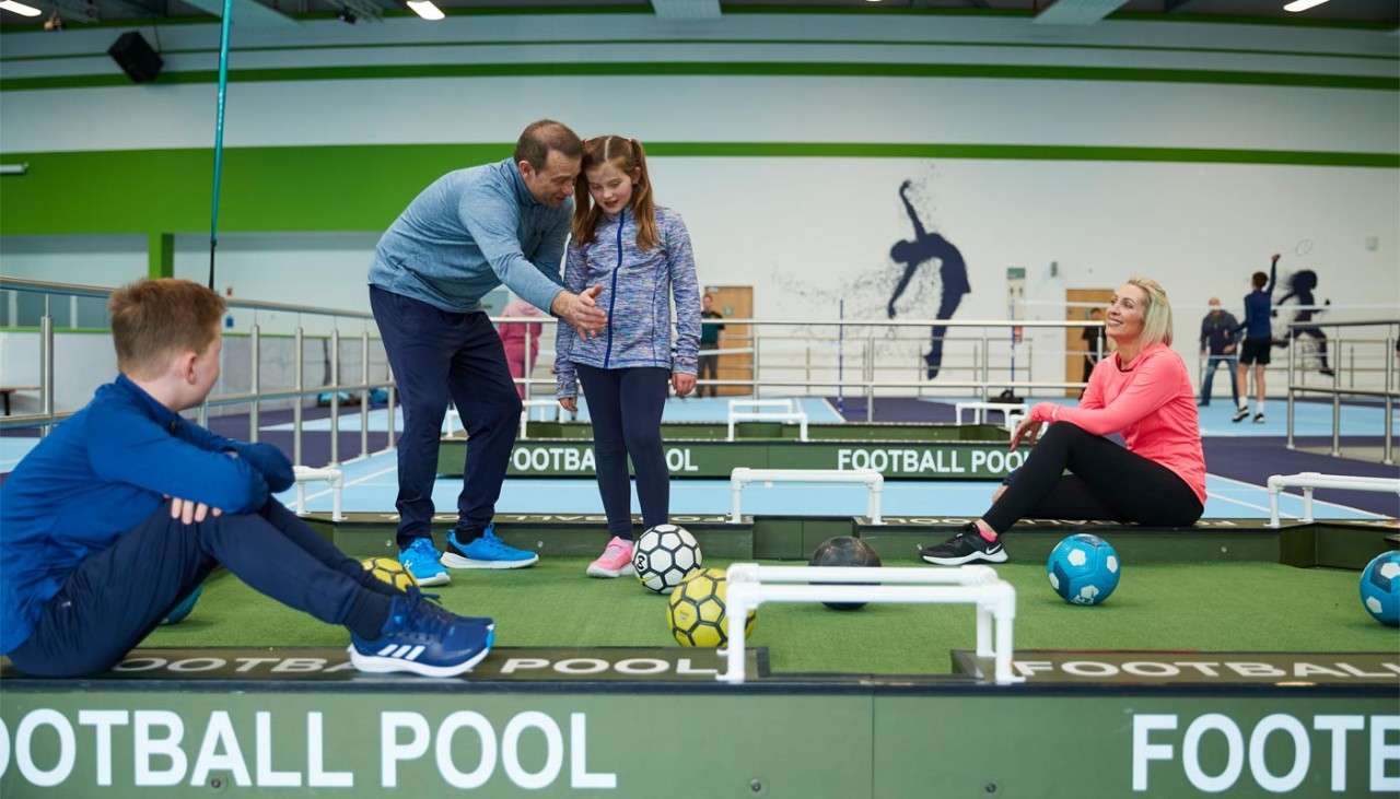 Family playing football pool