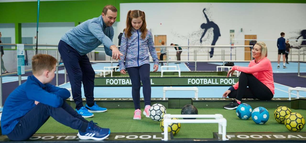 Family playing Football Pool