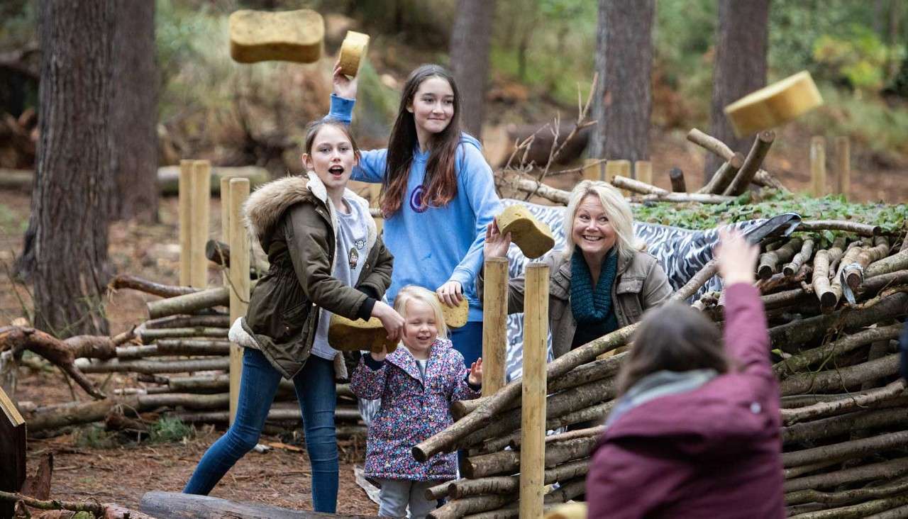 A family throwing sponges