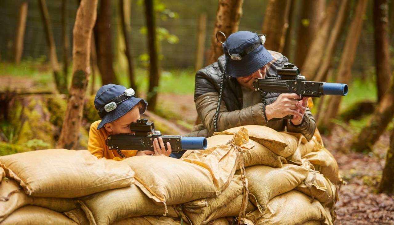 Man and boy taking part in Laser Combat