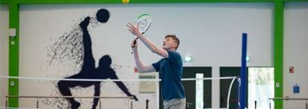 boy playing short tennis