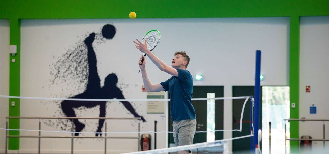 Boy playing short tennis