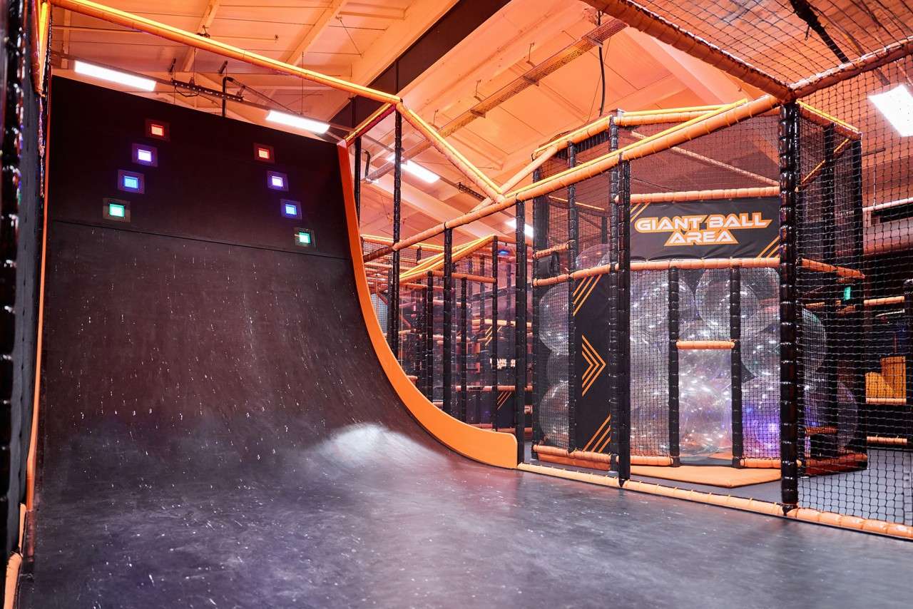 Slopped wall to run and reach up.