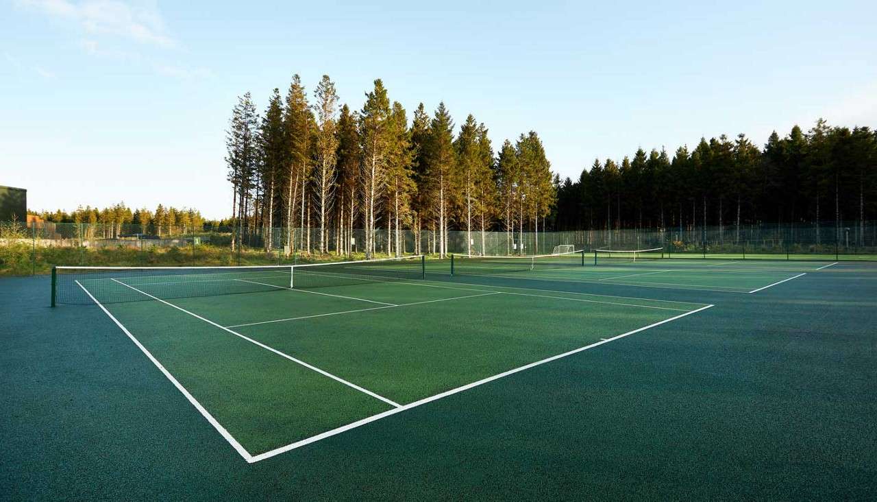 Outdoor Tennis Court surrounded by the forest