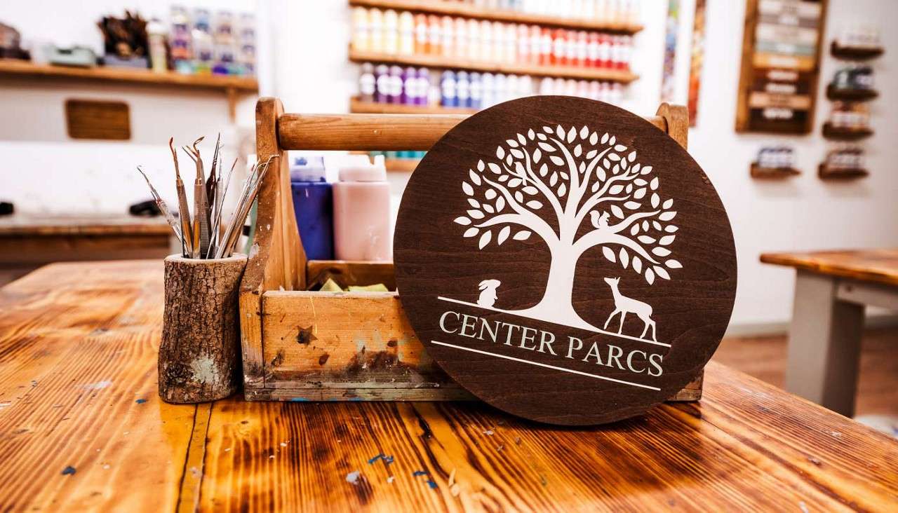 A selection of decorated wooden plaques.