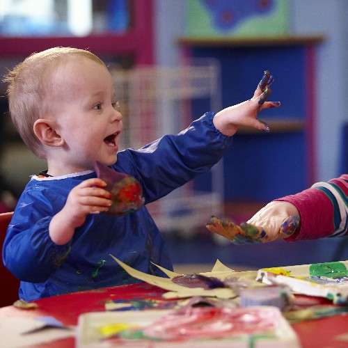 A boy showing his painted hands