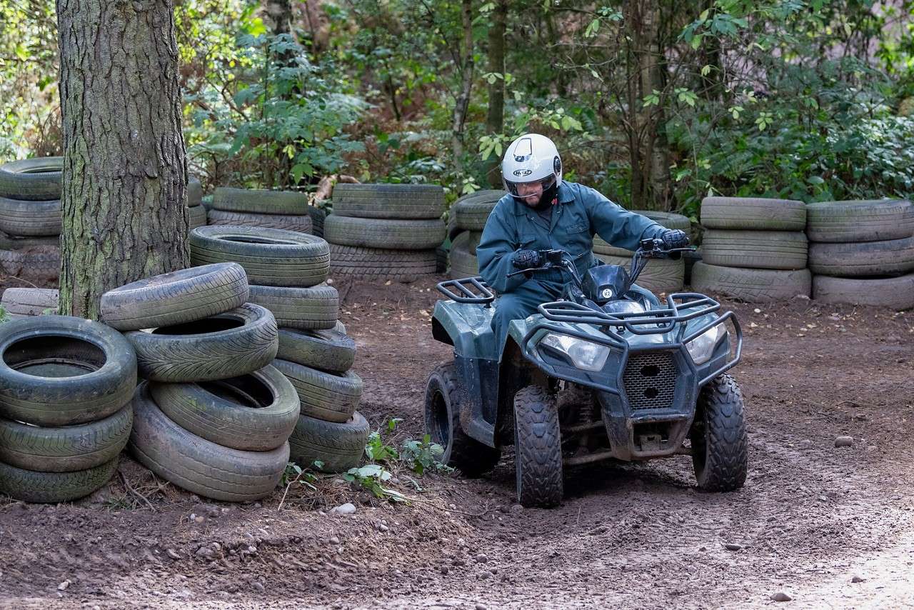 A man looking down as he turns the corner