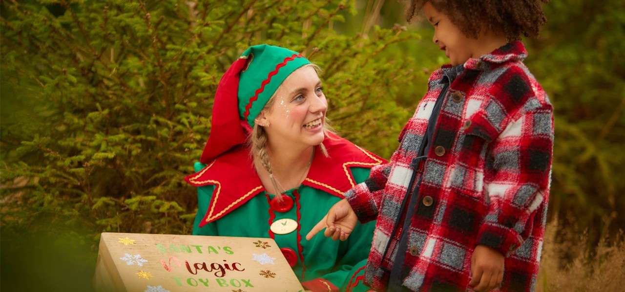 Elf leading the trail with young girl 