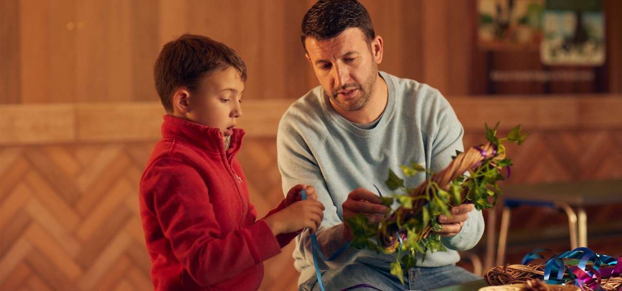 Dad and son making wreath
