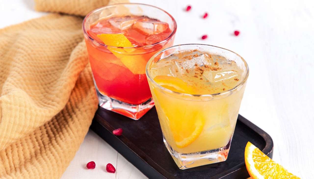 Colourful drinks in shot glasses.