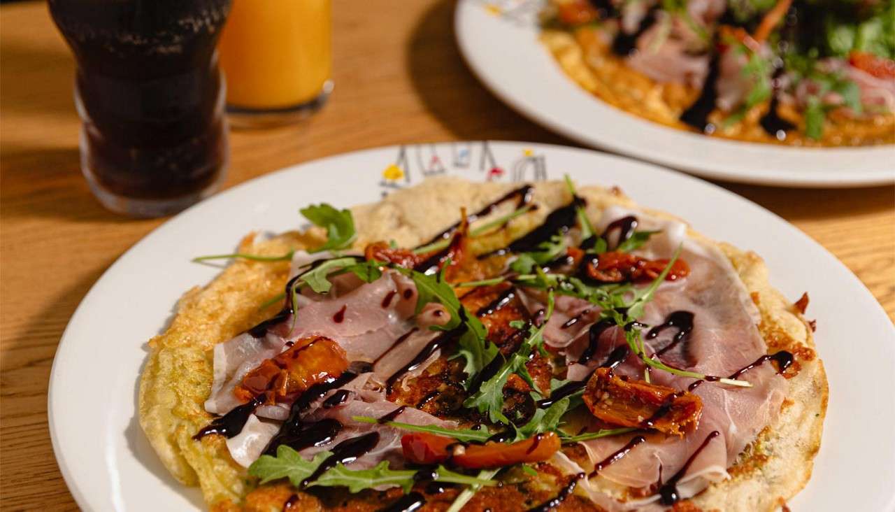 Omelette topped with Italian cured meats.
