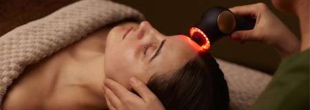 A woman receiving a natural glow facial