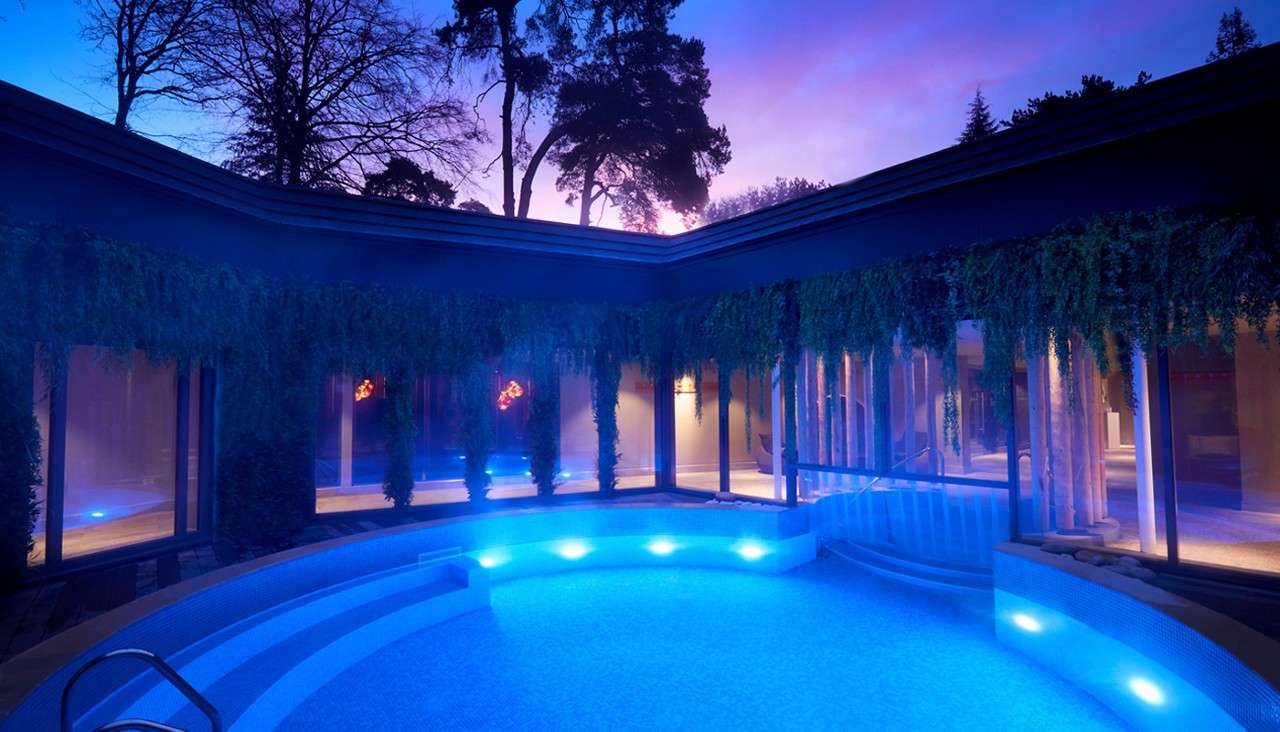 Round outdoor pool at dusk.