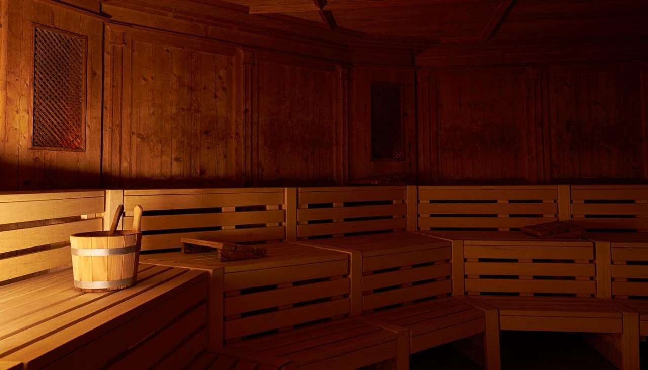 Inside a dim lit wooden sauna.