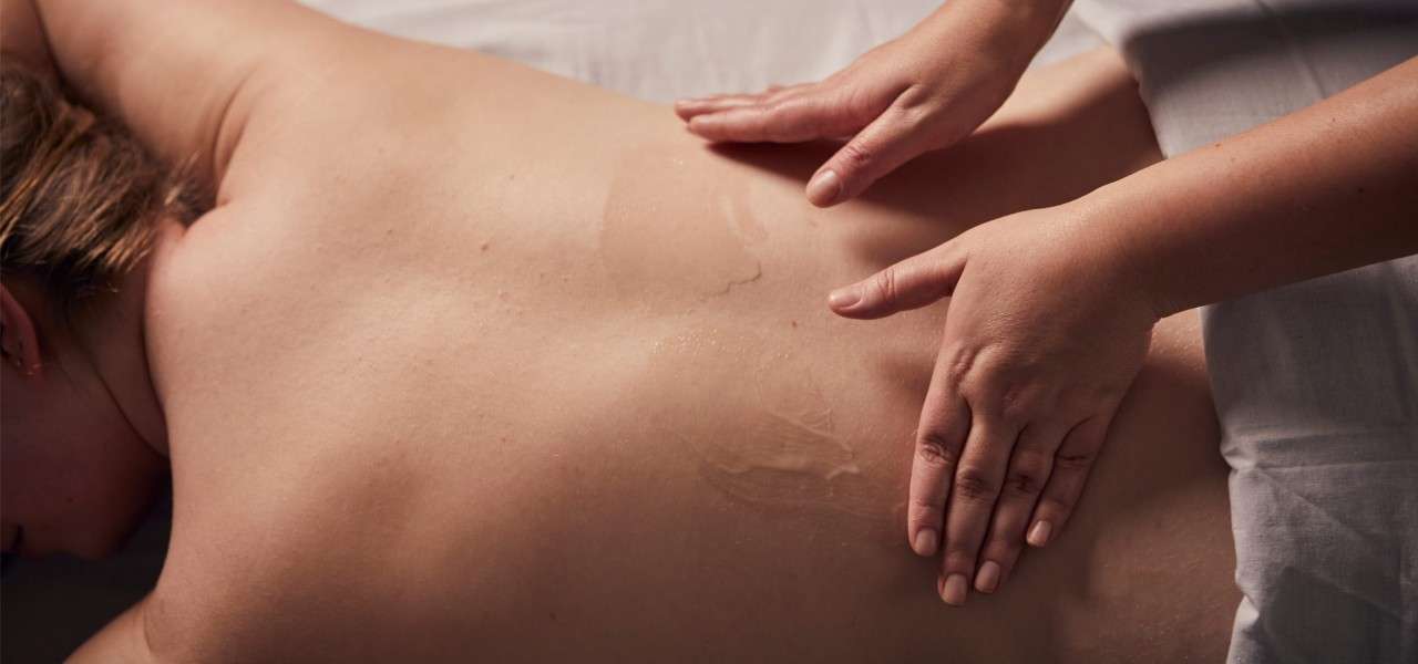 women having a back massage