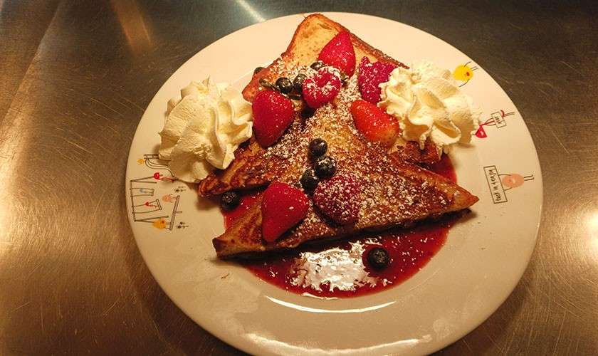 A dessert being prepared by the chefs