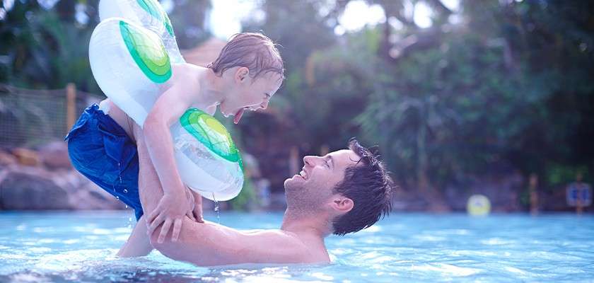 A father and his young child playing in the Subtropical Swimming Paradise