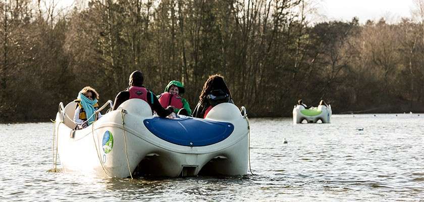 A family on an electric boat.
