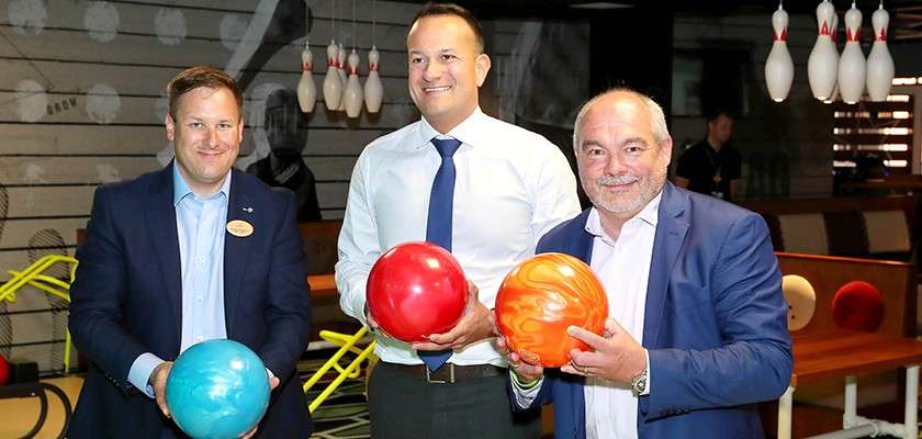 An Taeiseach holding bowling ball at Center Parcs bowling alley