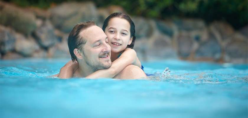Young girl and a man inside the Subtropical Swimming Paradise.