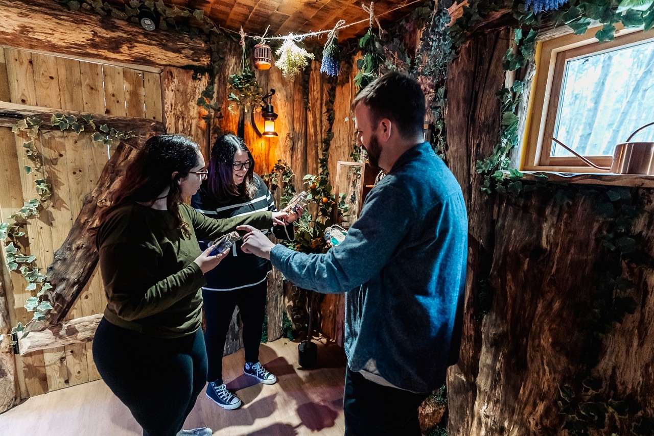 Three people taking part in Escape the Forest.