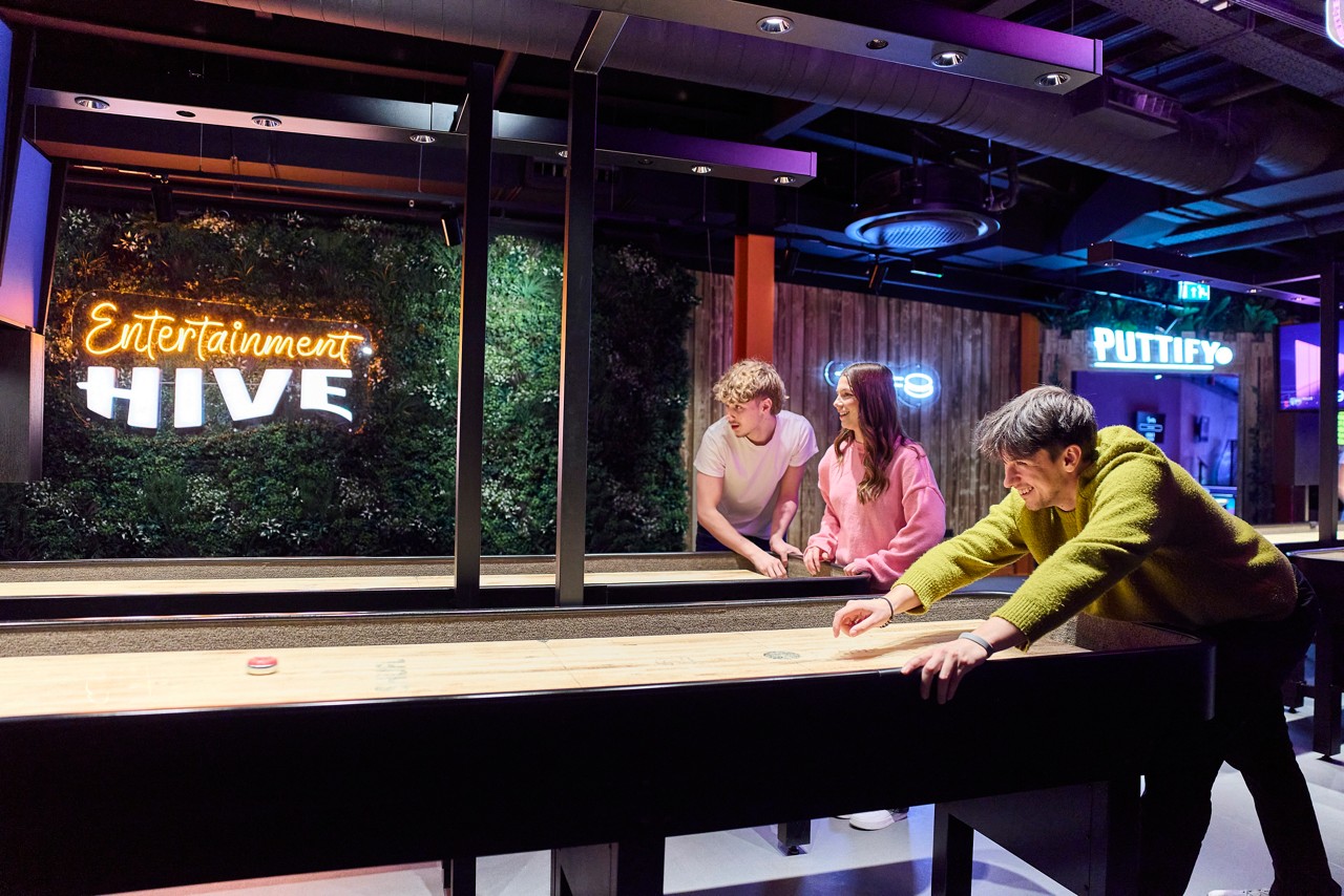 People playing shuffleboard
