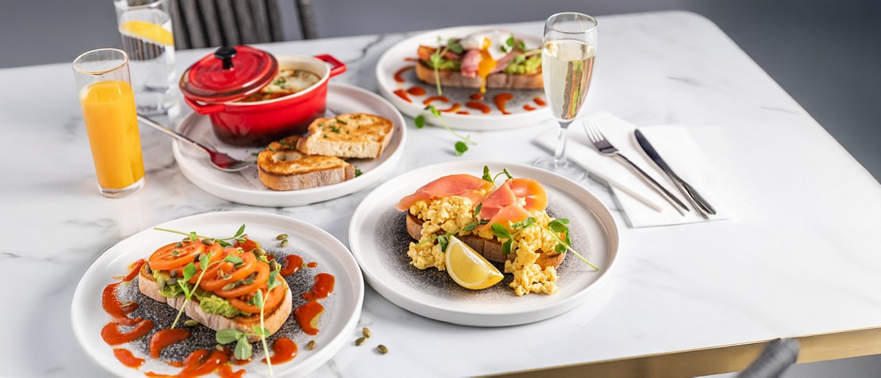 Brunch options including scrambled eggs on sourdough and lasagne. 