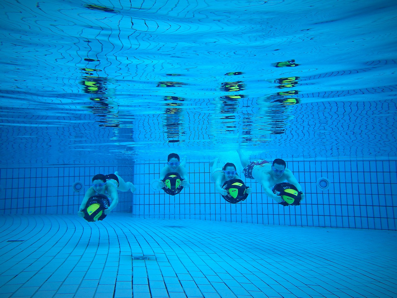 Family Aqua Jetting in the pool.