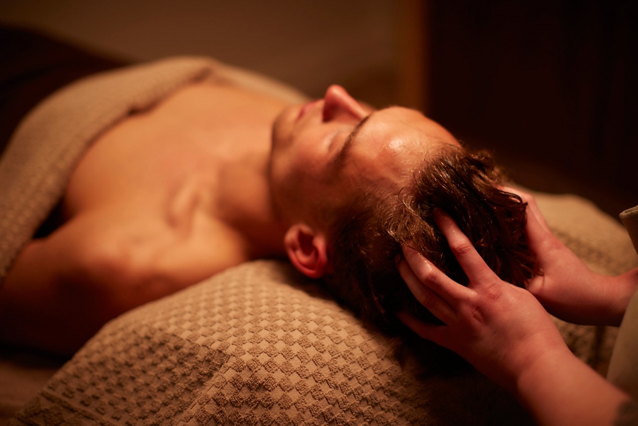 Man having a relaxing scalp massage.