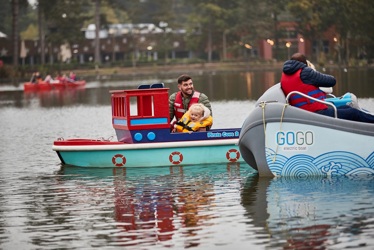Family playing crazy golf.