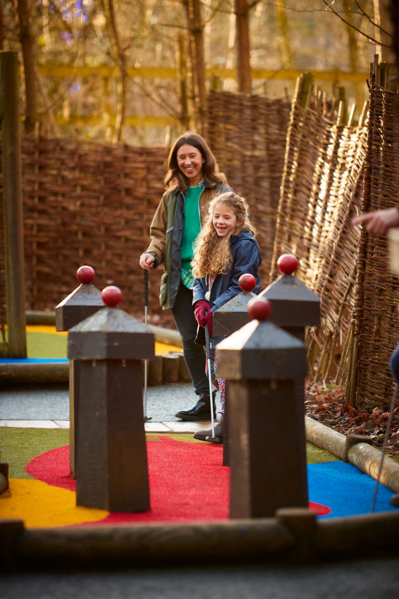 Family building a den in the forest.