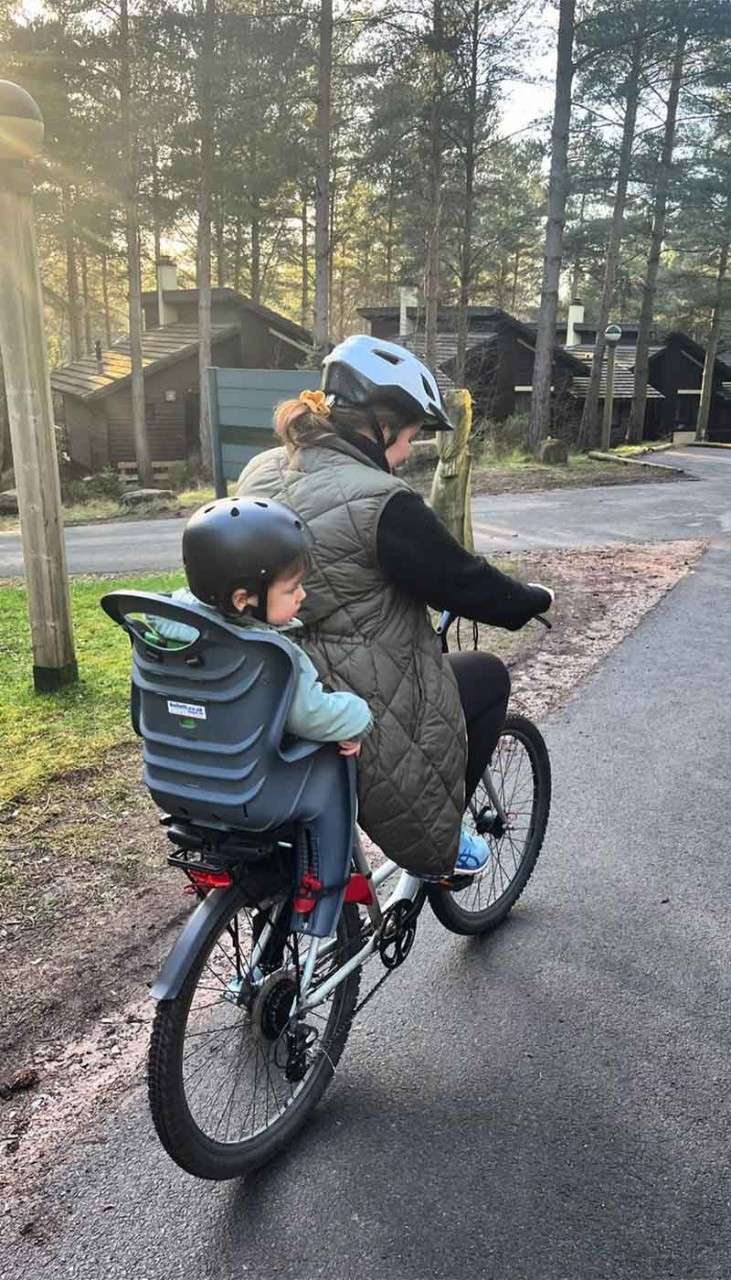 A mum and son on a bike.
